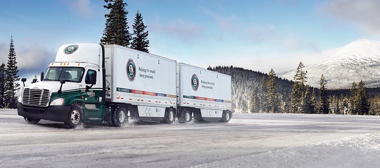 Old Dominion FreightLine Truck on snowy road by mountain