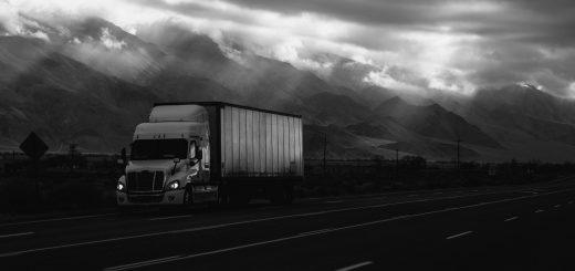 Truck on Highway next to mountain - B&W