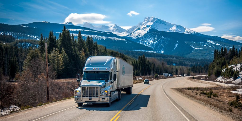 Highway truck Semi in mountains, Aging drivers threaten trucking workforce