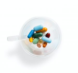 Pills in a cup ...Photo by Adam Nieścioruk on Unsplash