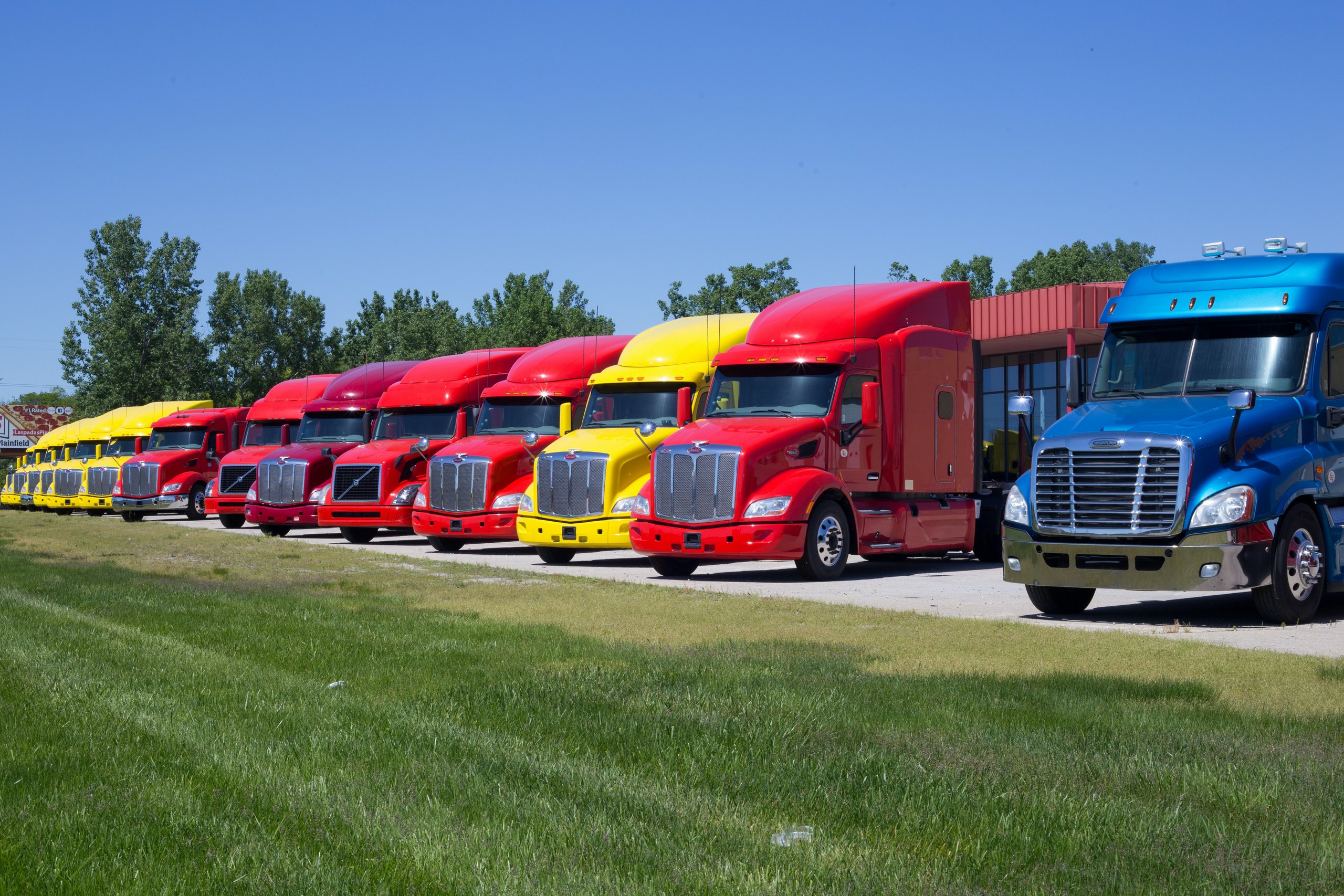 Line of colorful semi-trailer cabs.