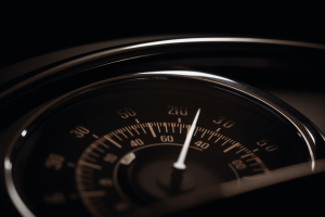 Artistic rendering of a speedometer, representing speed control and regulation in the trucking industry.