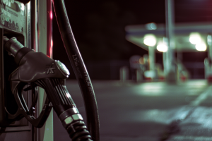 Gas station black pump closeup at night